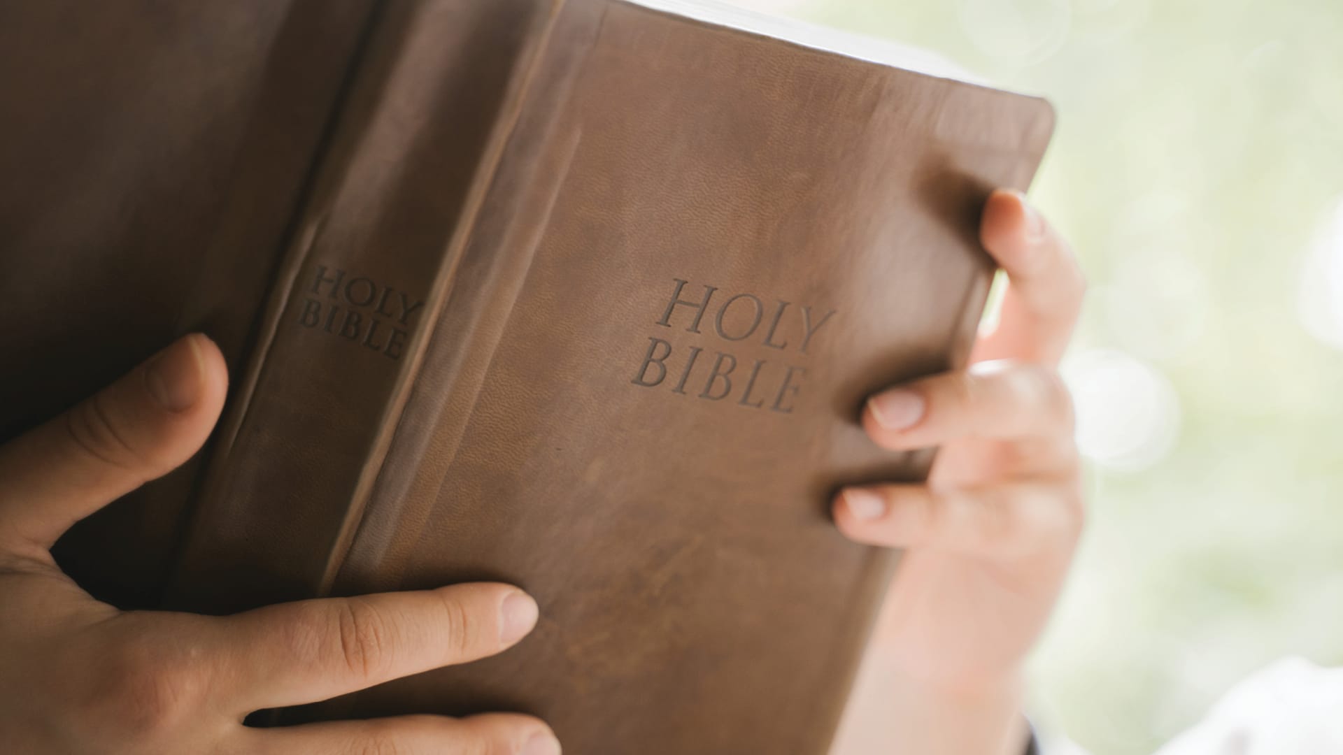 Woman holding open Bible