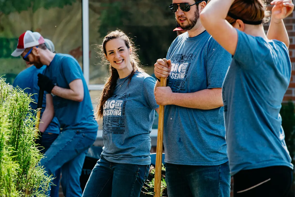 Young adults helping landscape during the Big Day of Serving event